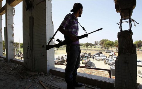 Libyan-rebel-in-Qaddafi’s-compound-Bab-al-Azizya-Tripoli-bombed-144x-082311-by-AP Libyan-rebel-in-Qaddafi’s-compound-Bab-al-Azizya-Tripoli-bombed-144x-082311-by-AP